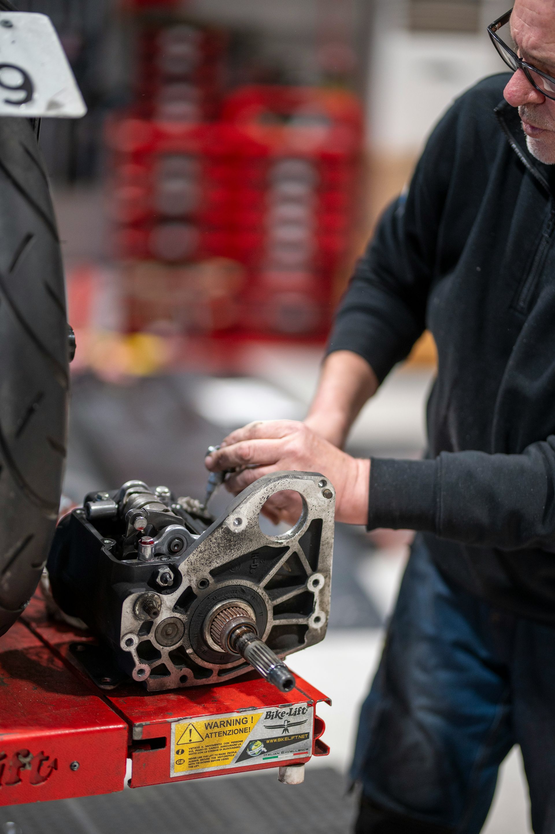 Mechanic working on a motorcycle engine