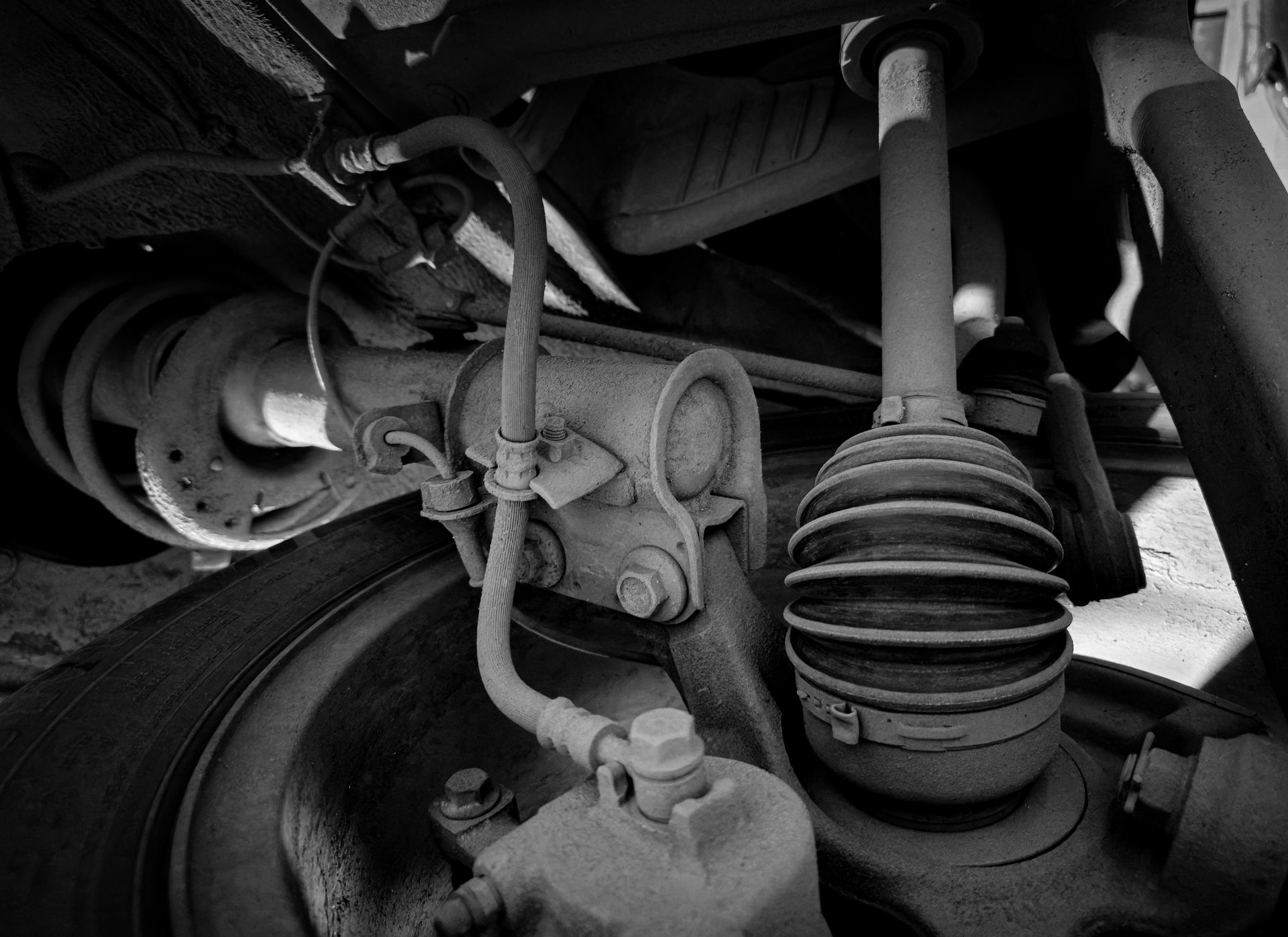 Close-up of a car's suspension and axle components.
